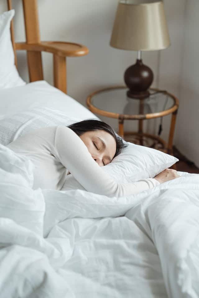 woman sleeps to recover from workout