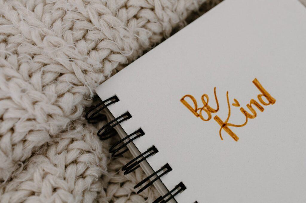 be kind written in a note book in gold lettering